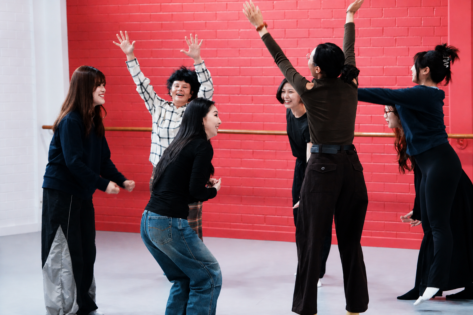 A lively group movement exercise in a studio
