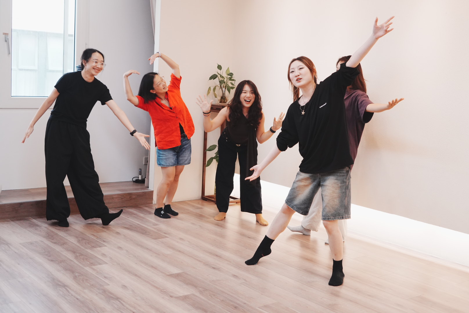 Participants exploring expressive movement together in a studio