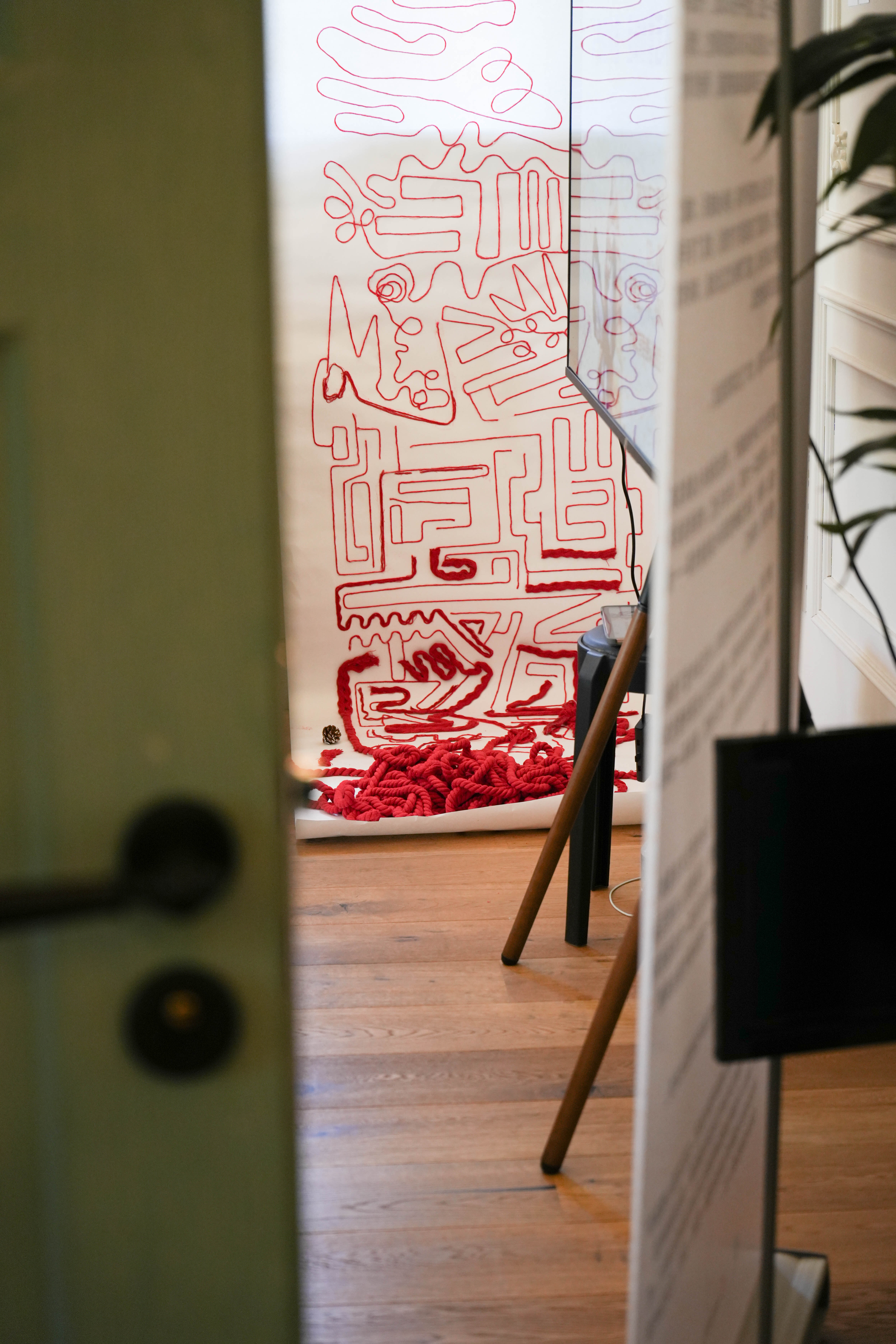 A red thread installation developed through a reflective creative process